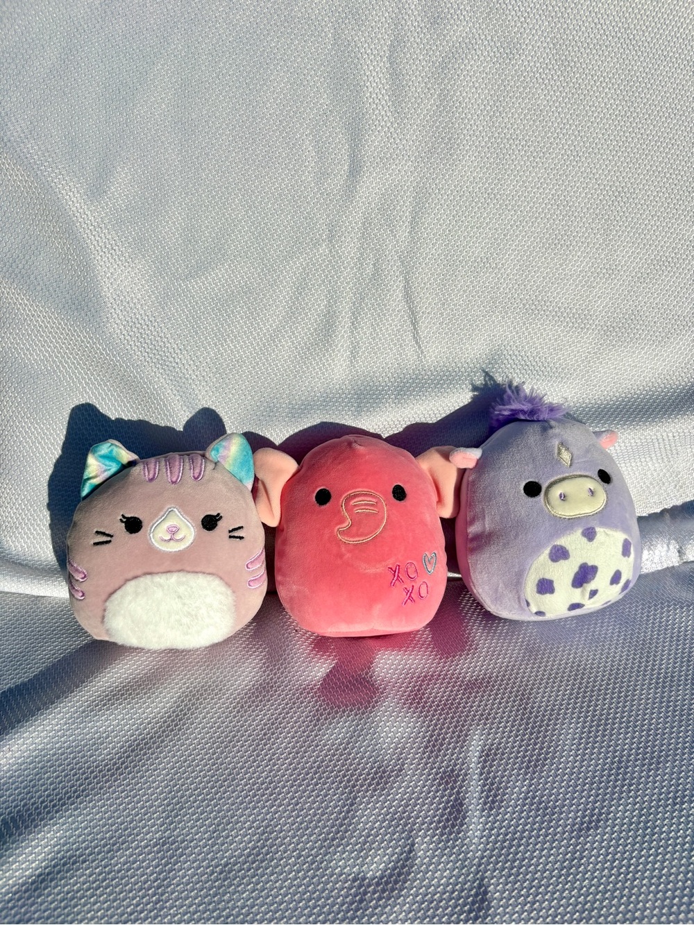 Squishmallows pink Elephant, purple Horse, and light pink Cat